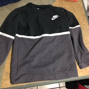 This is a grey and black Nike sweatshirt.
